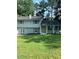 Newly renovated two-story home with a yellow door at 5364 Cedar Rock Dr, Stonecrest, GA 30038