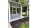 Front porch with new flooring and landscaping at 5364 Cedar Rock Dr, Stonecrest, GA 30038