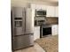 Stainless steel appliances in renovated kitchen at 5364 Cedar Rock Dr, Stonecrest, GA 30038