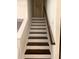 Clean staircase with dark wood accents and white risers at 5364 Cedar Rock Dr, Stonecrest, GA 30038