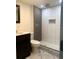 Bathroom with dark vanity and updated shower at 5364 Cedar Rock Dr, Stonecrest, GA 30038