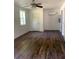 Bright living room with hardwood floors and ceiling fan at 5364 Cedar Rock Dr, Stonecrest, GA 30038