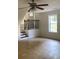 Spacious living area with ceiling fan and loft at 5364 Cedar Rock Dr, Stonecrest, GA 30038