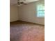 Large bedroom with neutral carpeting at 5364 Cedar Rock Dr, Stonecrest, GA 30038