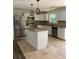 Updated kitchen with island and travertine flooring at 5364 Cedar Rock Dr, Stonecrest, GA 30038