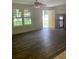 Spacious living room with dark hardwood floors and ceiling fan at 5364 Cedar Rock Dr, Stonecrest, GA 30038