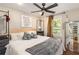 King-size bedroom with a ceiling fan and access to another room at 22 Waters Bridge Cir, Covington, GA 30014