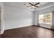 Spacious bedroom with hardwood floors and ceiling fan at 5610 Bower Pl, Cumming, GA 30028