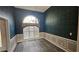 Elegant dining room with wainscoting and arched window at 41 Ludwick Ln, Lawrenceville, GA 30046