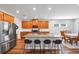 Modern kitchen with granite countertops, wooden cabinets, and stainless steel appliances at 446 Payne Rd, Woodstock, GA 30188