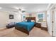 Large main bedroom with a king-size bed and sitting area at 446 Payne Rd, Woodstock, GA 30188