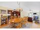 Bright dining room with wood table and chairs, open to living room at 2298 Cole Lake Rd, Dallas, GA 30157