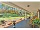 Relaxing front porch with rocking chairs, overlooking a beautifully landscaped yard at 2298 Cole Lake Rd, Dallas, GA 30157