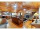 Open living room with hardwood floors and stone fireplace at 2298 Cole Lake Rd, Dallas, GA 30157