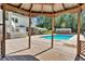 Inviting backyard oasis featuring a refreshing pool, spacious deck, and a relaxing gazebo at 2298 Cole Lake Rd, Dallas, GA 30157