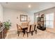 Elegant dining room with a modern table and chairs at 230 Mackenzie Ct, Covington, GA 30016