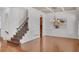 Bright dining room with hardwood floors, chandelier, and white wainscoting at 4853 Stonehall Pl, Atlanta, GA 30339