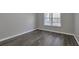 Spacious bedroom with large window and wood-look floors at 970 Sidney Marcus Ne Blvd # 1204, Atlanta, GA 30324