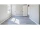 Bright bedroom with gray vinyl flooring and access to other rooms at 42 Guinn St, Marietta, GA 30060