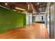 Hallway featuring a green wall and hardwood floors at 323 Edgewood Se Ave # A, Atlanta, GA 30312