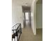 Clean hallway with tile flooring and access to bedrooms at 2055 Highway 138 Sw, Riverdale, GA 30296