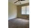 Bedroom with brown carpet, neutral walls, and window at 2055 Highway 138 Sw, Riverdale, GA 30296