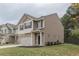 Side view of two-story house showcasing neutral siding and landscaping at 770 Galveston Way, Mcdonough, GA 30253