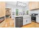 Modern kitchen with white cabinets, stainless steel appliances, and a large island at 220 Fair St, Loganville, GA 30052