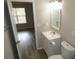 Bathroom with vanity, toilet and view into another room at 221 Bentley Pl, Tucker, GA 30084