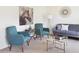 Living room with teal armchairs and a gray sofa at 2489 Argento Cir, Dacula, GA 30019