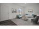 Living room with light walls, hardwood floors, and modern furniture at 2489 Argento Cir, Dacula, GA 30019