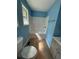 Clean bathroom with a tub, toilet, and vanity at 8165 Thompson St, Douglasville, GA 30134