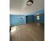 Dining area with light wood floors and blue walls at 8165 Thompson St, Douglasville, GA 30134