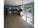 Open concept kitchen with stainless steel appliances and wood-look floors at 8165 Thompson St, Douglasville, GA 30134