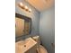 Modern bathroom with updated fixtures and a stylish mirror at 8165 Thompson St, Douglasville, GA 30134