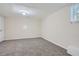 Spacious carpeted basement room with neutral walls at 443 Creekwood Pass, Dallas, GA 30157