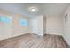 Bright living room featuring vinyl flooring and neutral walls at 443 Creekwood Pass, Dallas, GA 30157