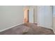 Cozy bedroom featuring neutral carpeting and built-in closet at 4660 Edwina Sw Ln, Atlanta, GA 30331