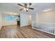 Open living room with hardwood floors and kitchen view at 4660 Edwina Sw Ln, Atlanta, GA 30331