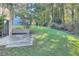 Spacious backyard with grassy area and patio at 4660 Edwina Sw Ln, Atlanta, GA 30331