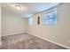 Basement bedroom with neutral walls, carpet, and multiple windows at 4660 Edwina Sw Ln, Atlanta, GA 30331