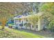 Brick ranch home with covered porch and landscaping at 4660 Edwina Sw Ln, Atlanta, GA 30331