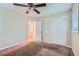 Spacious bedroom with neutral walls, ceiling fan and large closet at 4660 Edwina Sw Ln, Atlanta, GA 30331