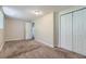 Spacious basement bedroom with double-door closet and carpet at 4660 Edwina Sw Ln, Atlanta, GA 30331