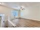 Open living room with hardwood floors and ceiling fan at 4660 Edwina Sw Ln, Atlanta, GA 30331