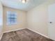 Bright bedroom with neutral walls, carpet, and window coverings at 4660 Edwina Sw Ln, Atlanta, GA 30331