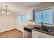 Eat-in kitchen with granite countertops and modern dishwasher at 4660 Edwina Sw Ln, Atlanta, GA 30331