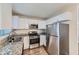 Updated kitchen with stainless steel appliances and granite countertops at 4660 Edwina Sw Ln, Atlanta, GA 30331