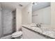 Basement bathroom with granite countertop, shower, and updated fixtures at 4660 Edwina Sw Ln, Atlanta, GA 30331