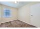 Spacious bedroom with neutral walls, carpet flooring, and ample closet space at 4660 Edwina Sw Ln, Atlanta, GA 30331